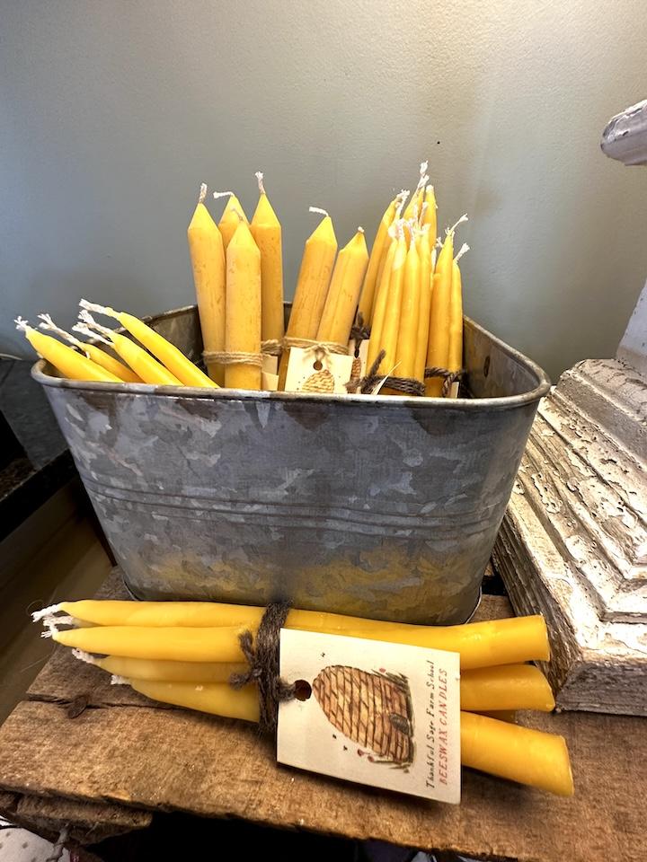 Photo of beeswax taper candles in the gift shop of Brick Church Meats & More