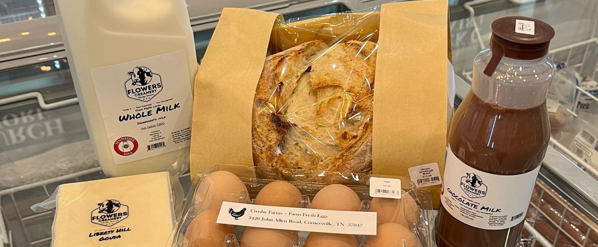 Photo of chocolate milk, eggs, whole milk, bread and cheese from Brick Church Meats and More